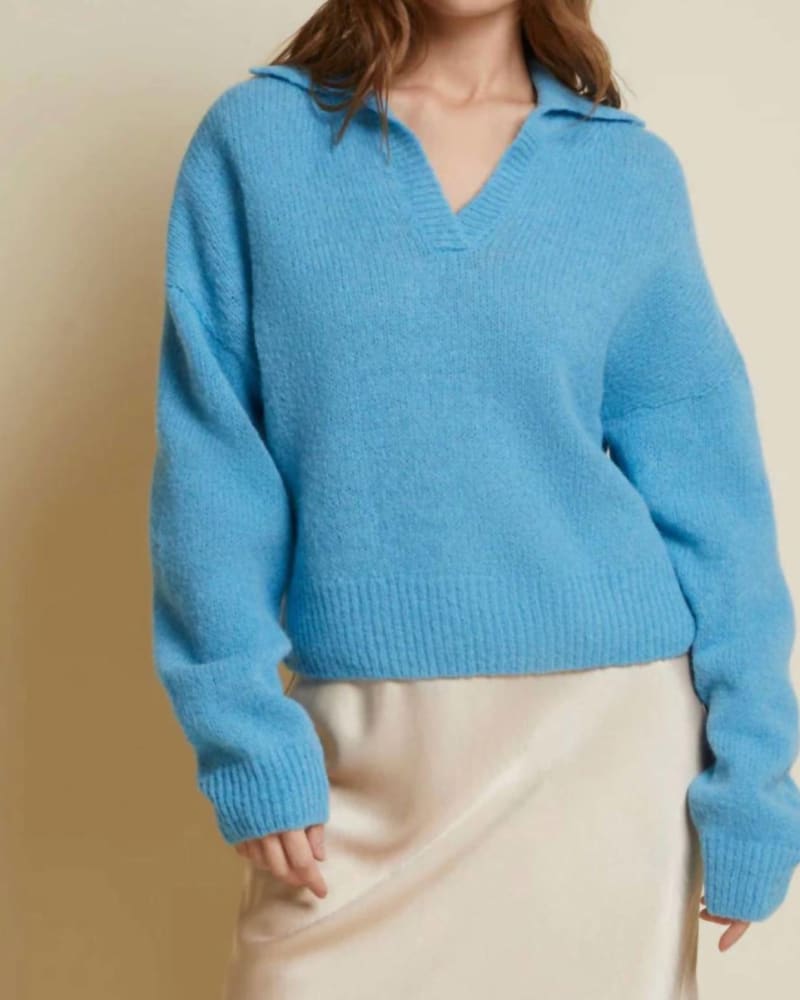 Front of a model wearing a size L Georgie Polo Sweater in Cornflower in Cornflower by Nation LTD. | dia_product_style_image_id:343601